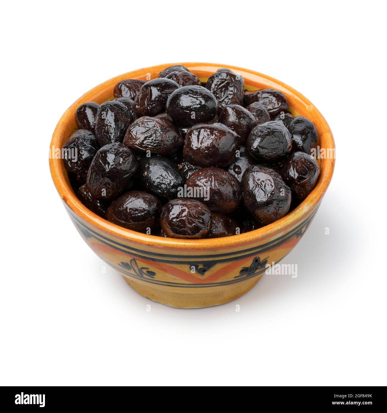 Bowl with traditional Moroccan black breakfast olives close up isolated on white background Stock Photo