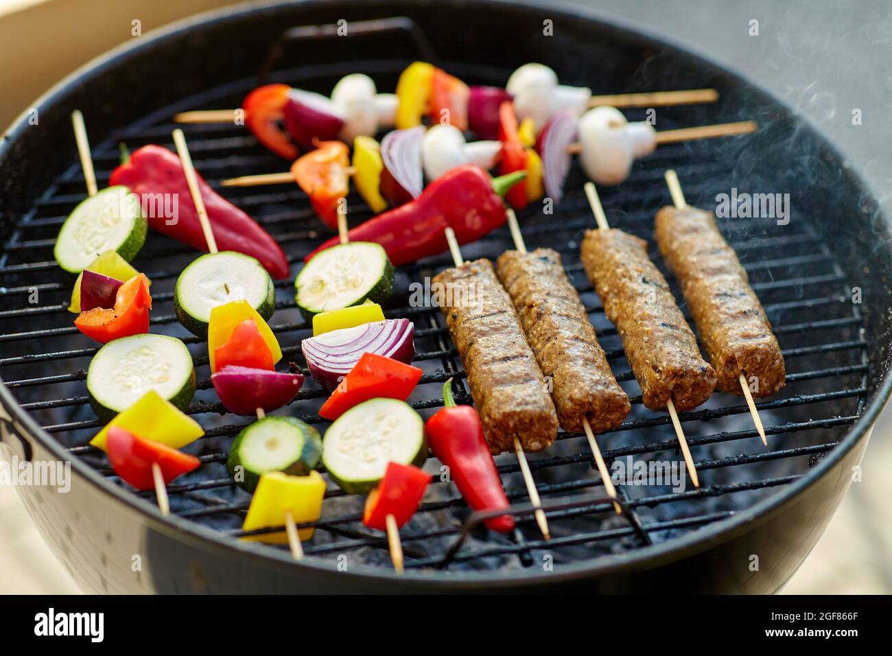 barbecue meat and vegetables roasting on grill Stock Photo Alamy