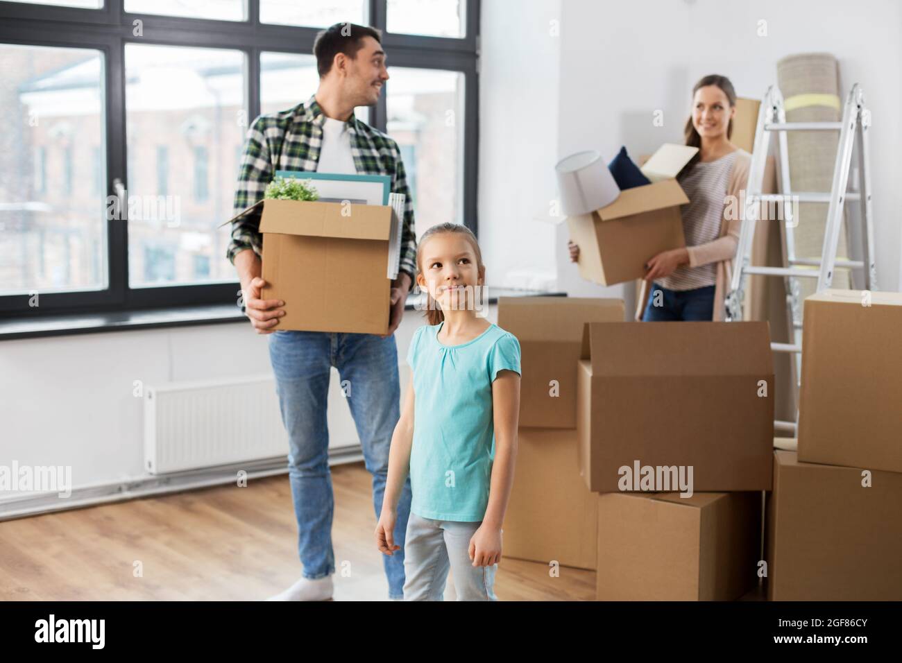 happy family with child moving to new home Stock Photo - Alamy