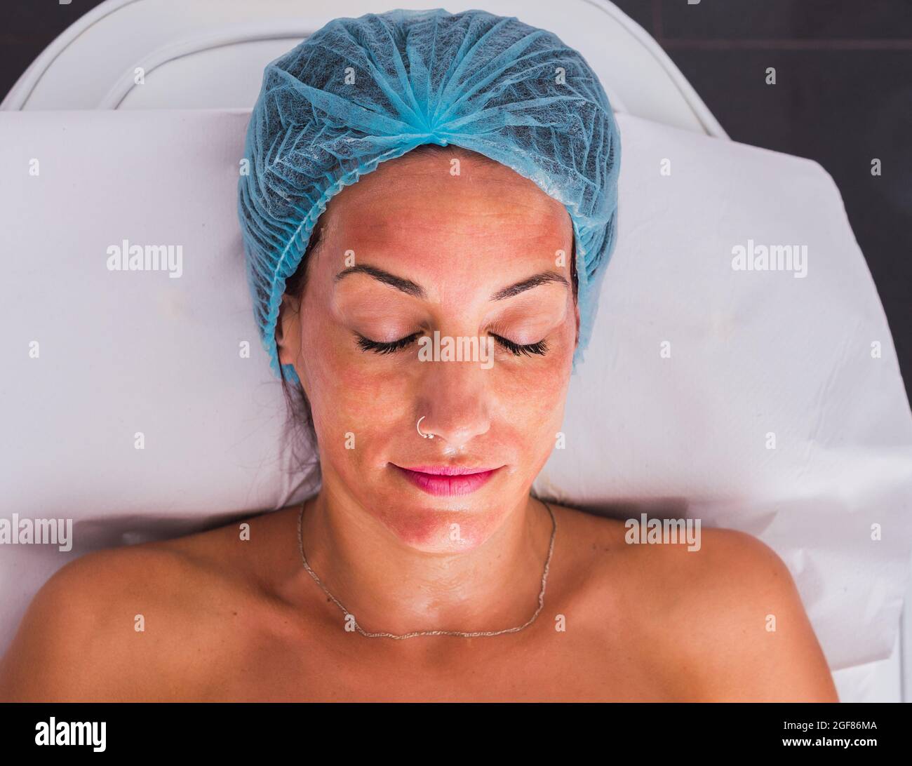 Mid adult woman face cream apply hi-res stock photography and images ...