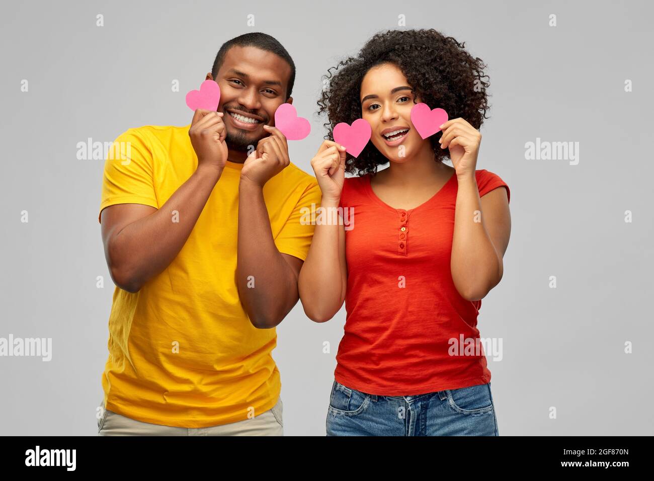 happy african american couple with hearts Stock Photo - Alamy