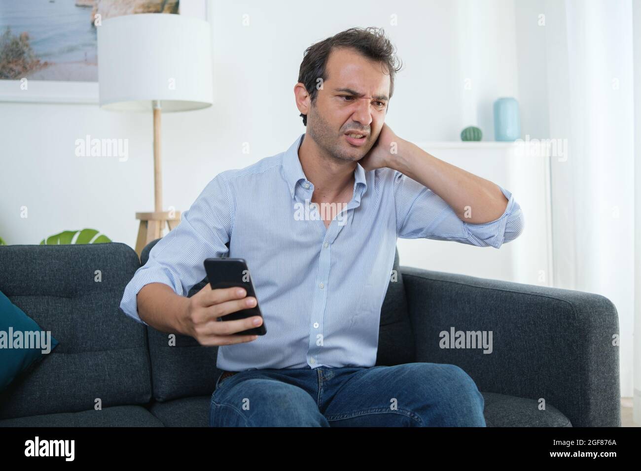 Pain and neck ache after smartphone overuse concept Stock Photo Alamy