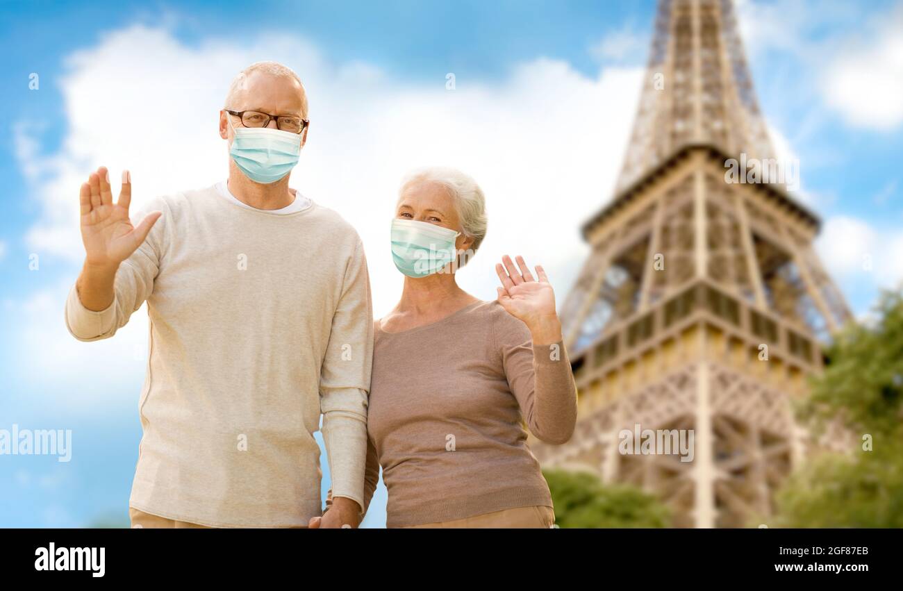old couple in protective medical masks in france Stock Photo - Alamy