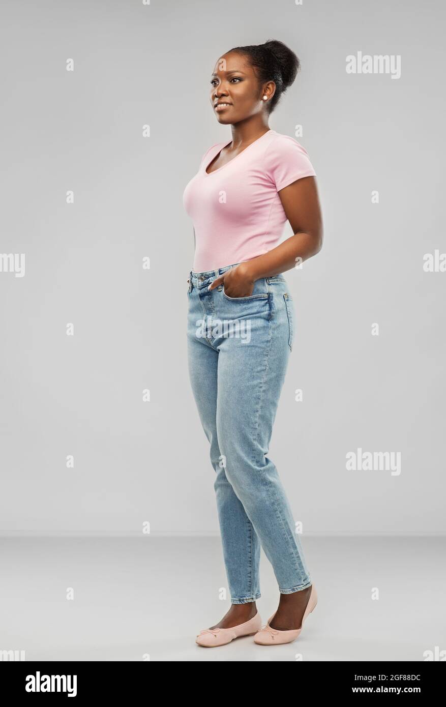 happy african american woman over grey background Stock Photo - Alamy