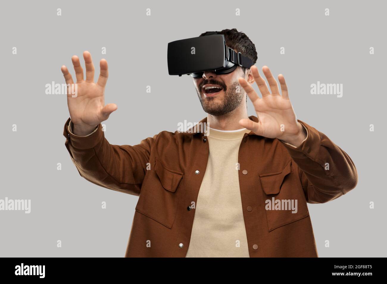 happy smiling young man in vr glasses Stock Photo