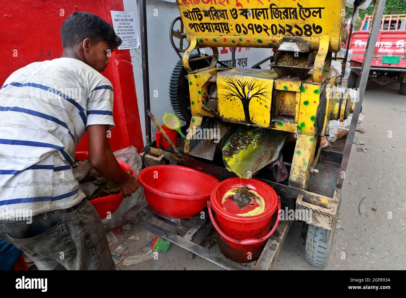 Dhaka, Bangladesh August 22, 2021 A mustard oil seller in Badda