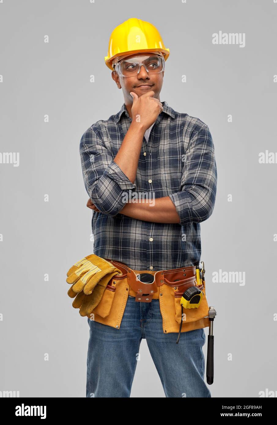 happy indian worker or builder with crossed arms Stock Photo
