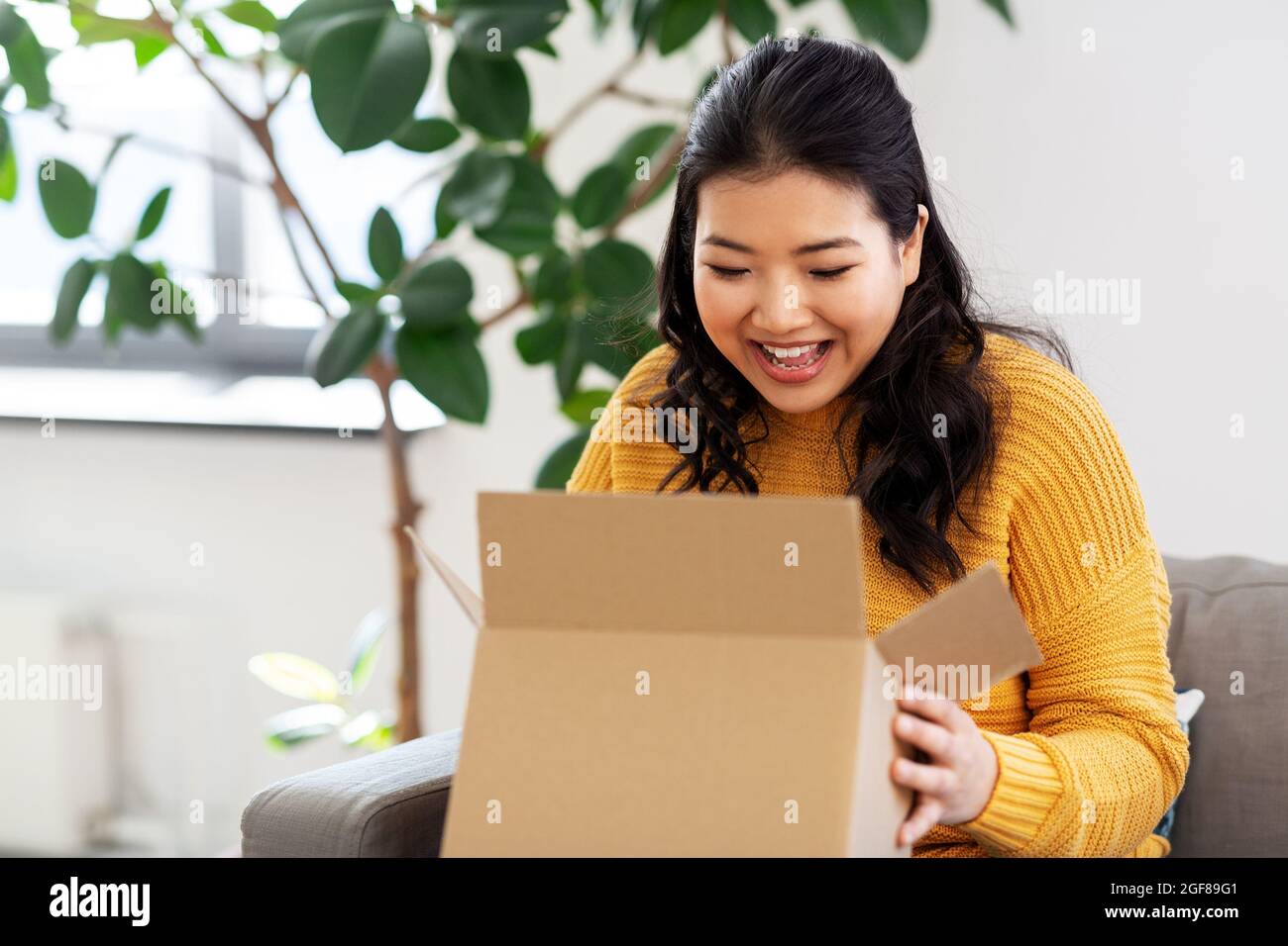 Happy satisfied asian female hi-res stock photography and images - Alamy