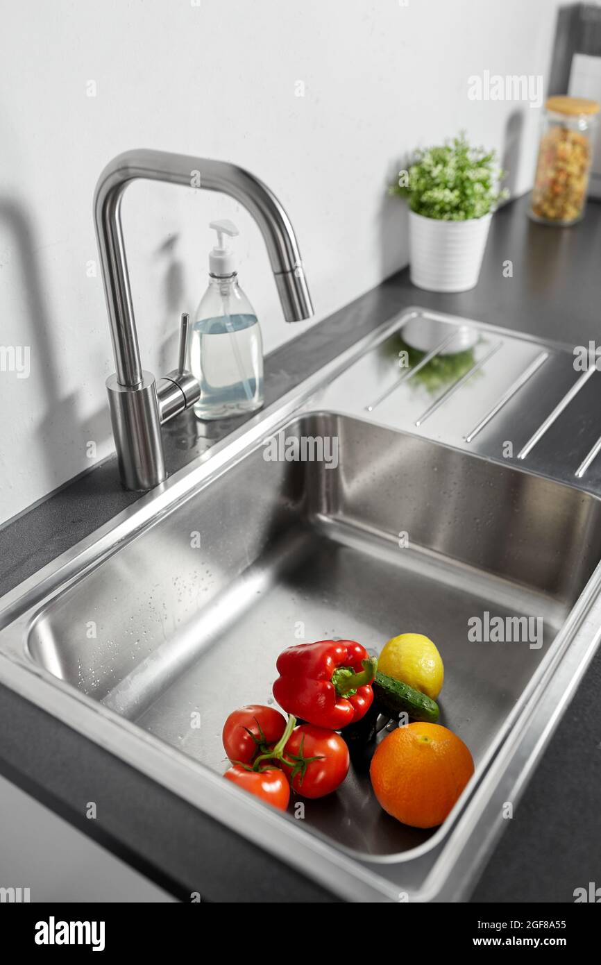 fruits and vegetables in kitchen sink Stock Photo Alamy