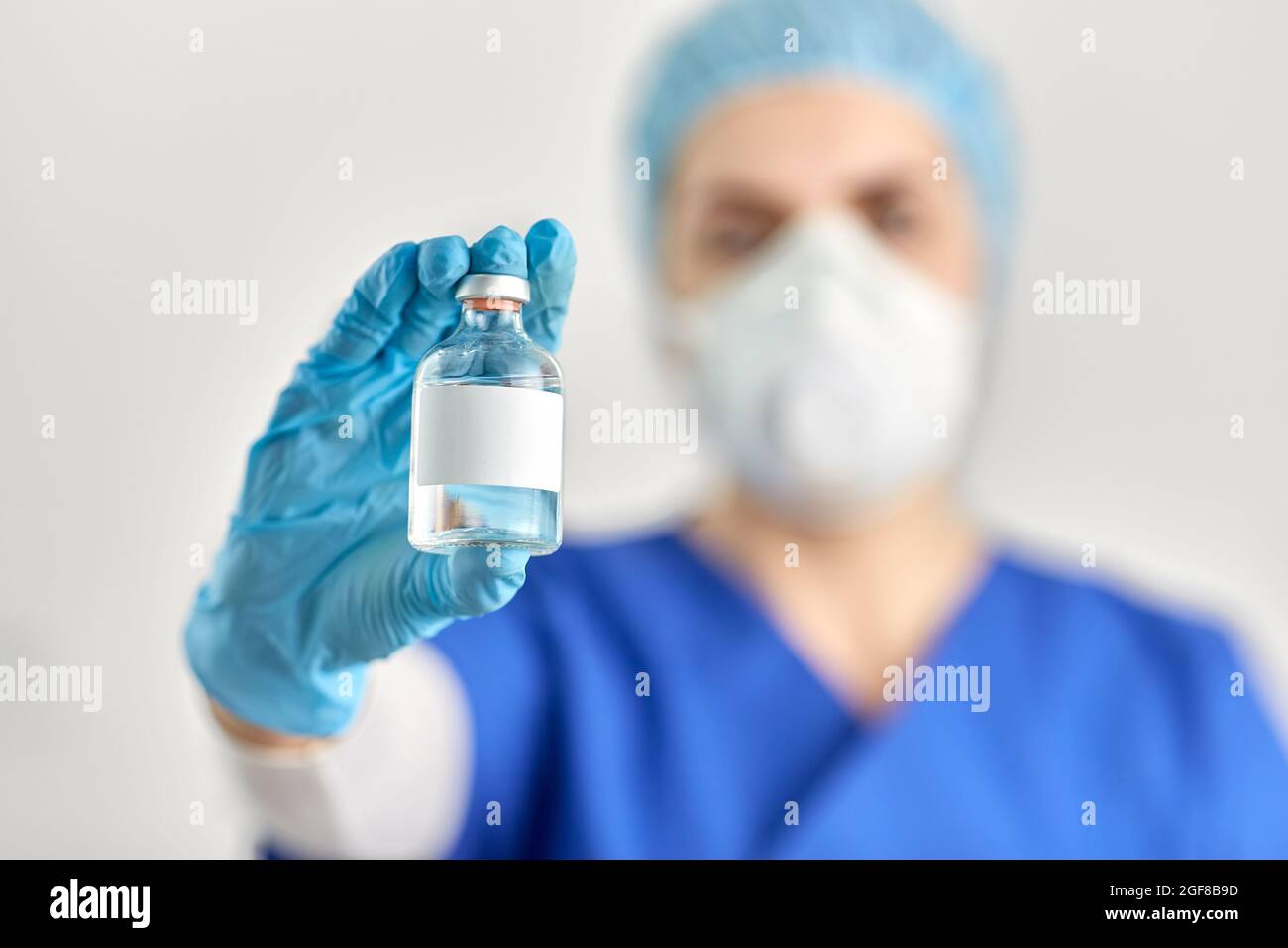 close up of doctor's hand with bottle of medicine Stock Photo - Alamy