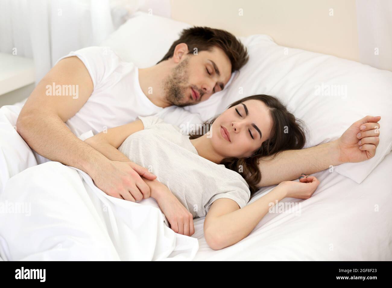 Young Cute Couple Sleeping Together In Bed Stock Photo Alamy Young Cute Couple Sleeping Together In Bed 2GF8F23