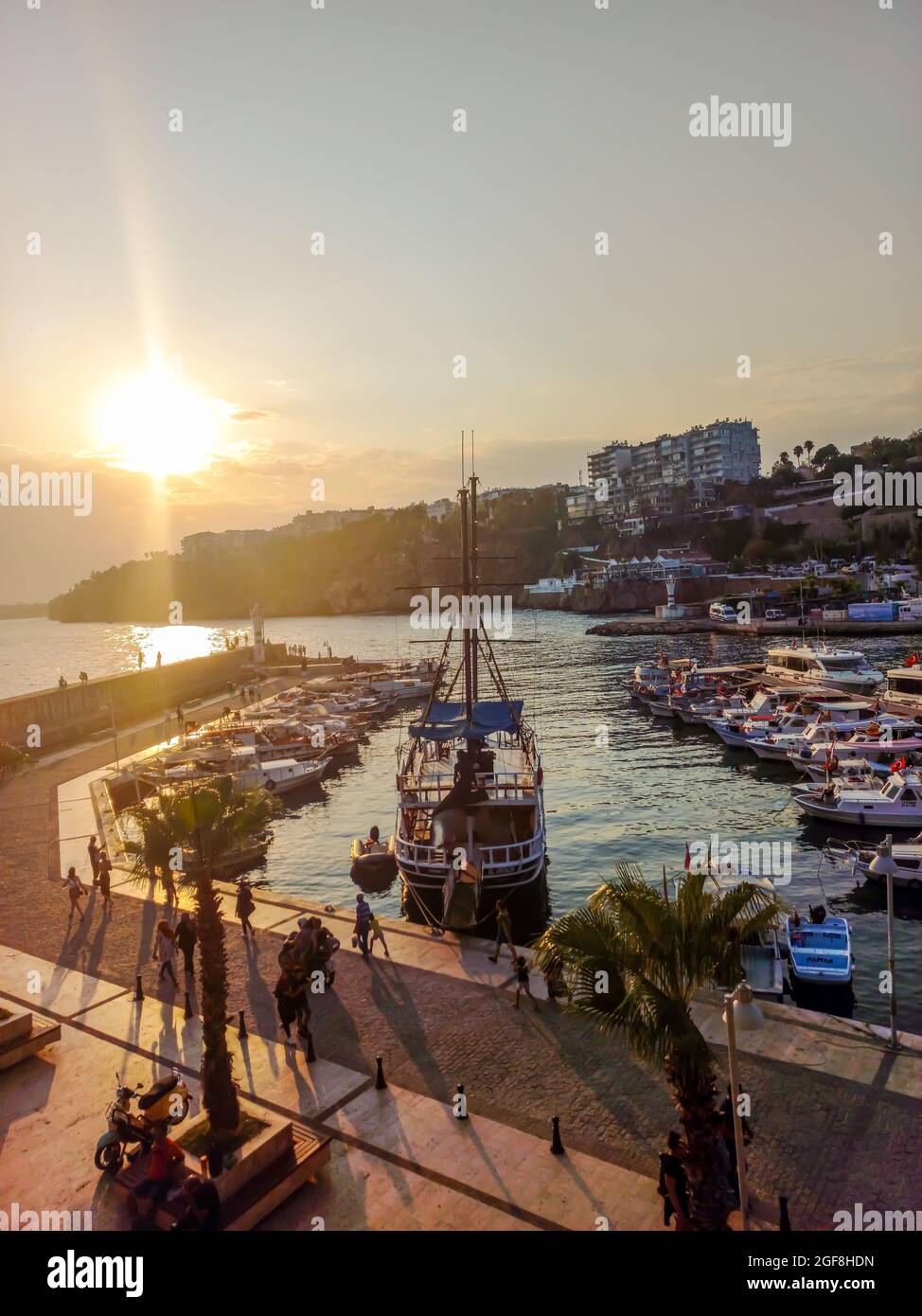 Antalya, Turkey - August 22, 2021: Boats docked at sunset in Kaleici, Antalya. Stock Photo