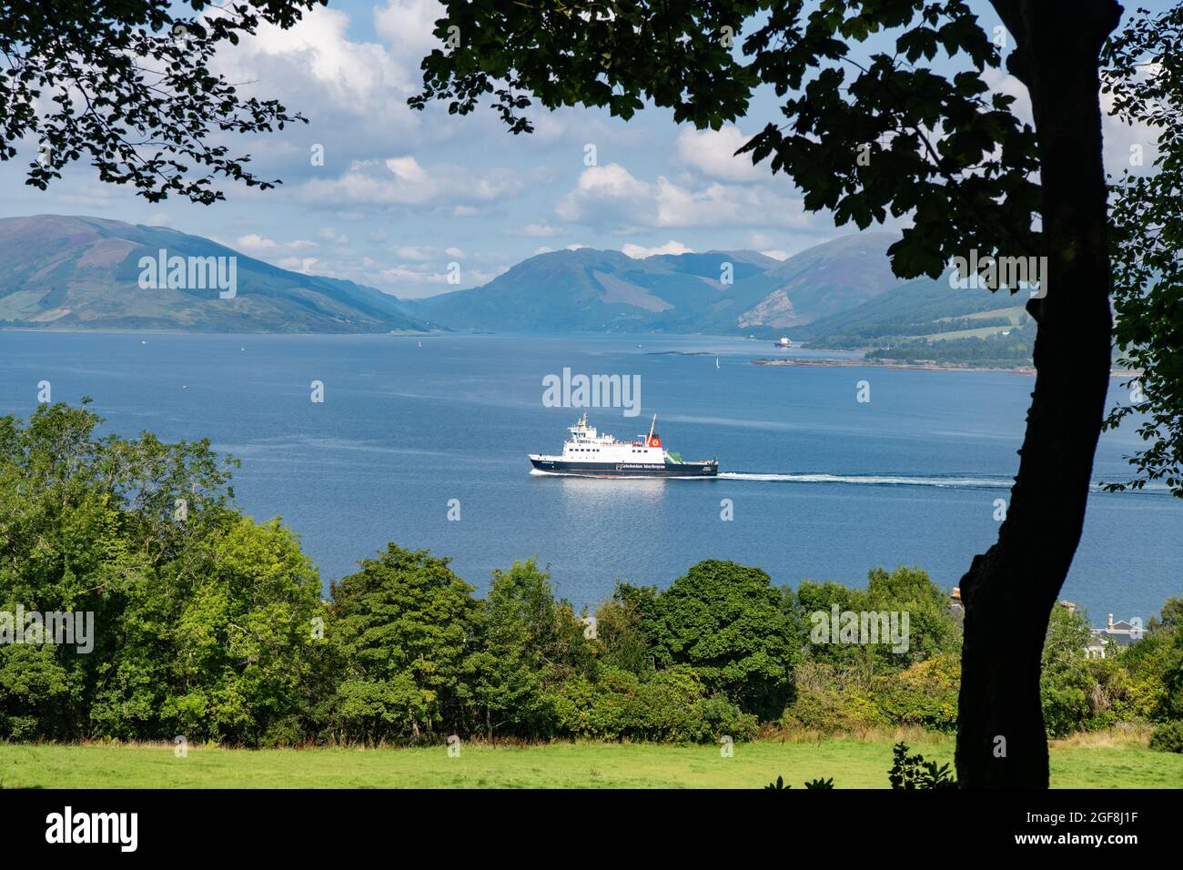 Rothesay, Isle of Bute, Scotland, UK. 24th Aug, 2021. UK weather - once the morning fog which led to the cancellation of early ferries from Weymss Bay, the Isle of Bute looked as pretty as a postcard with blue skies and glorious sunshine. Pictured MV Argyle sailing into Rothesay Credit: Kay Roxby/Alamy Live News Stock Photo
