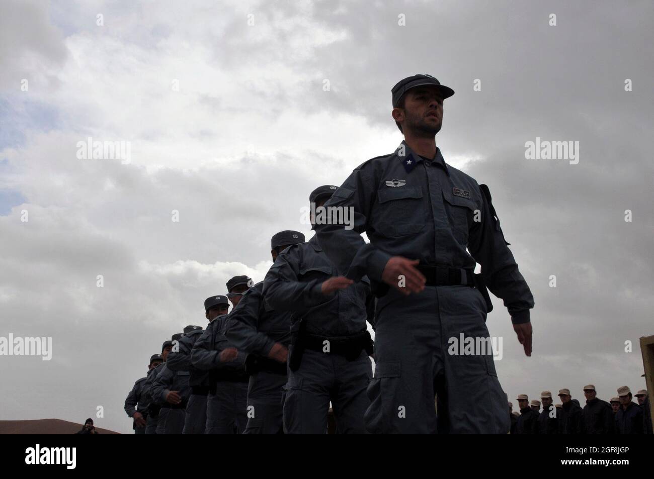 A formation of Afghan National Police recruits march during their graduation ceremony at Forward Operating Base Adraskan, Herat Province, Feb. 3, 2011. They will now join the ranks of the Afghan National Police. Stock Photo