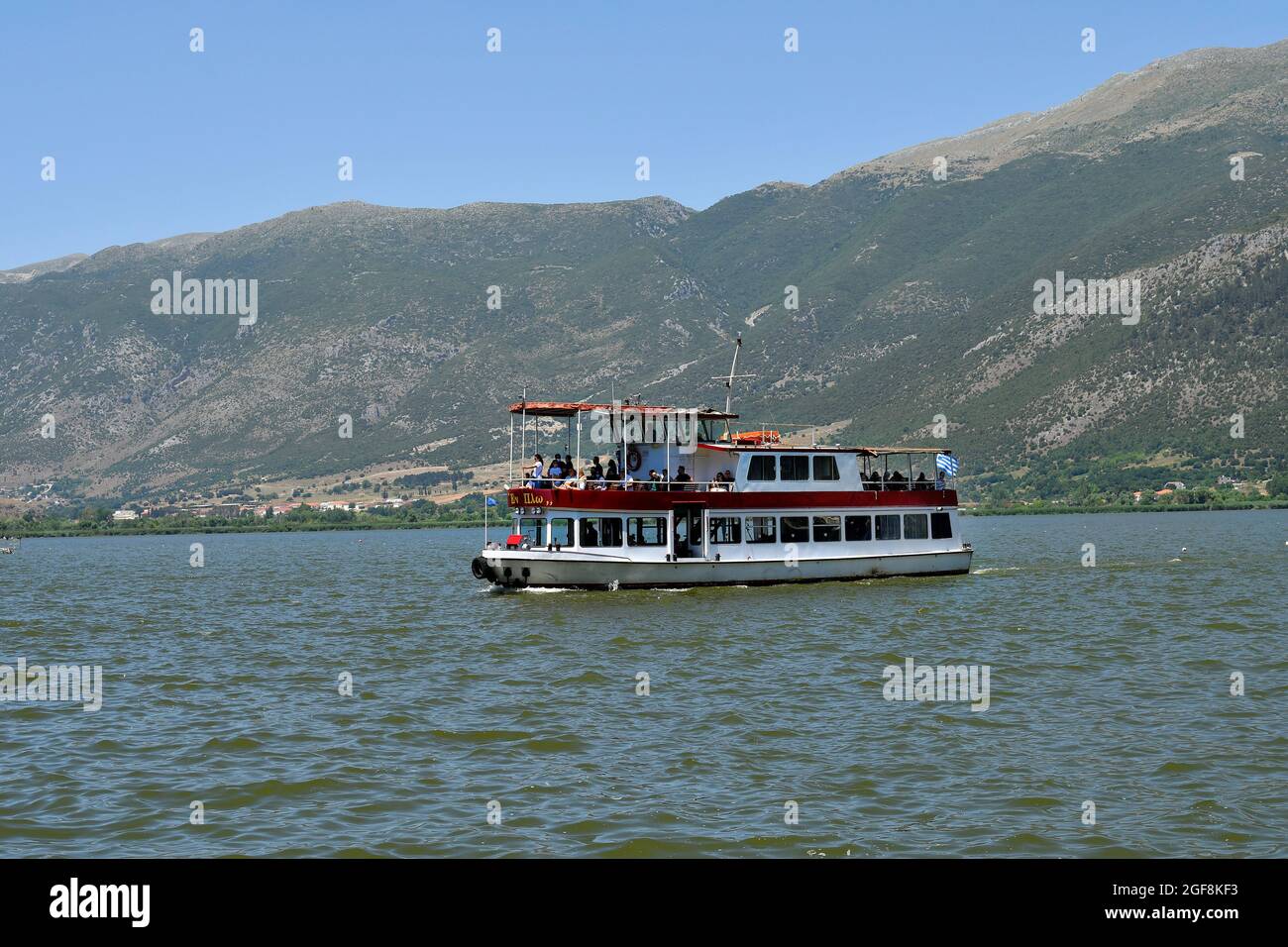 Ioannina, Greece - June 27, 2021: Unidentified people on ferry between Ioannina city and the island in Lake Pamvotida aka Ioannina Lake Stock Photo