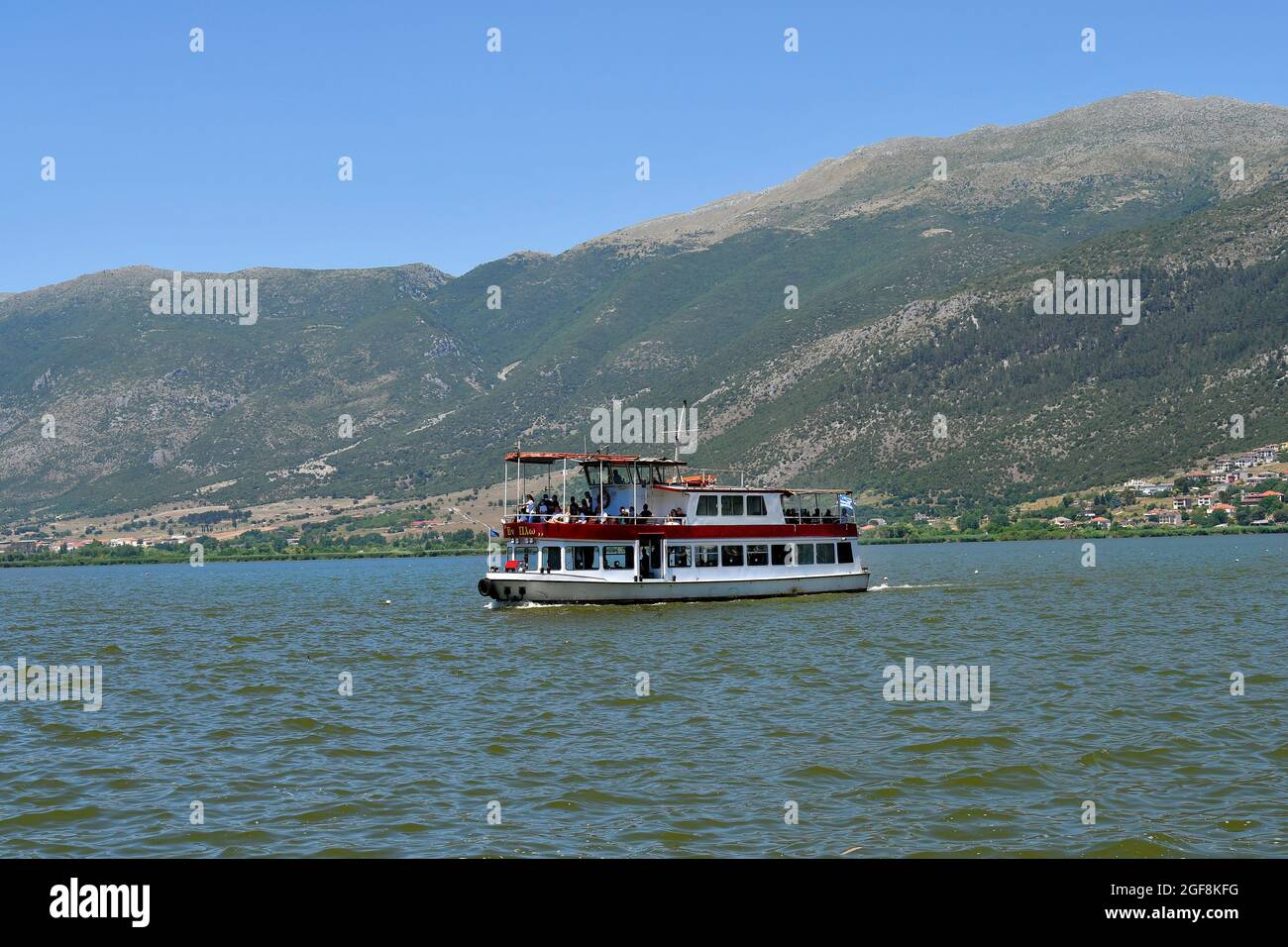 Ioannina, Greece - June 27, 2021: Unidentified people on ferry between Ioannina city and the island in Lake Pamvotida aka Ioannina Lake Stock Photo