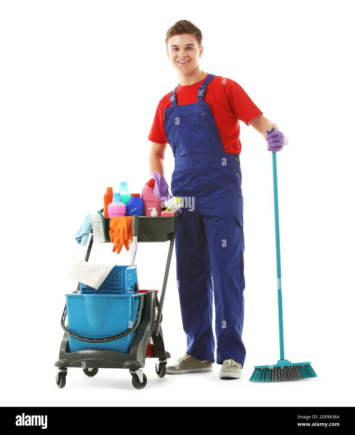 Young janitor with cleaner cart, isolated on white Stock Photo Alamy