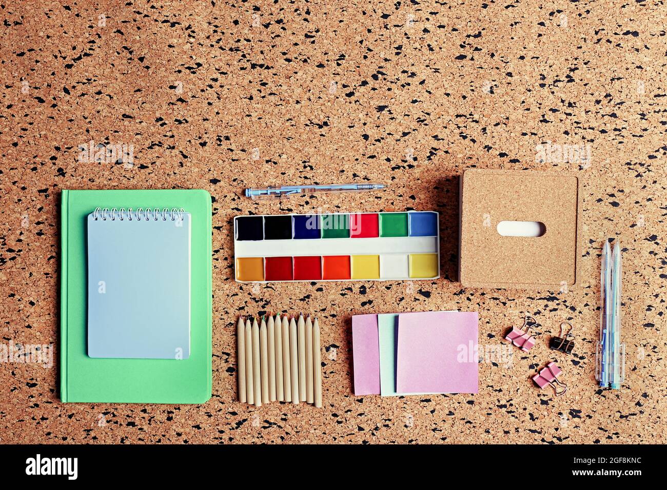 Stationery on cork desk background Stock Photo Alamy