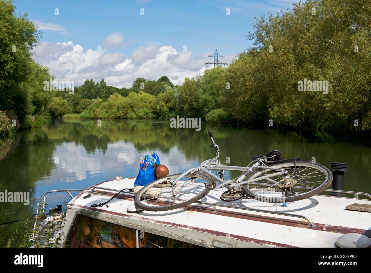 Bicycle on narrowboat moored on the River Lea at Hoddesdon, Hertfordshire, England UK Stock Photo
