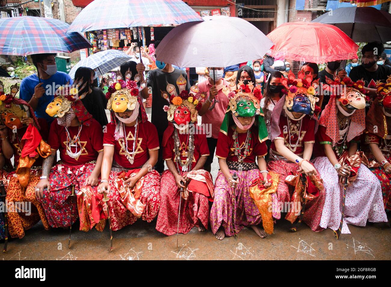 Devotees dressed up as deities take part in a traditional procession during  Khadga Jatra, the Sword festival at Hadigaun. Newar community's masked  dancers known as Ajimas celebrate the Payo Jatra festival Stock