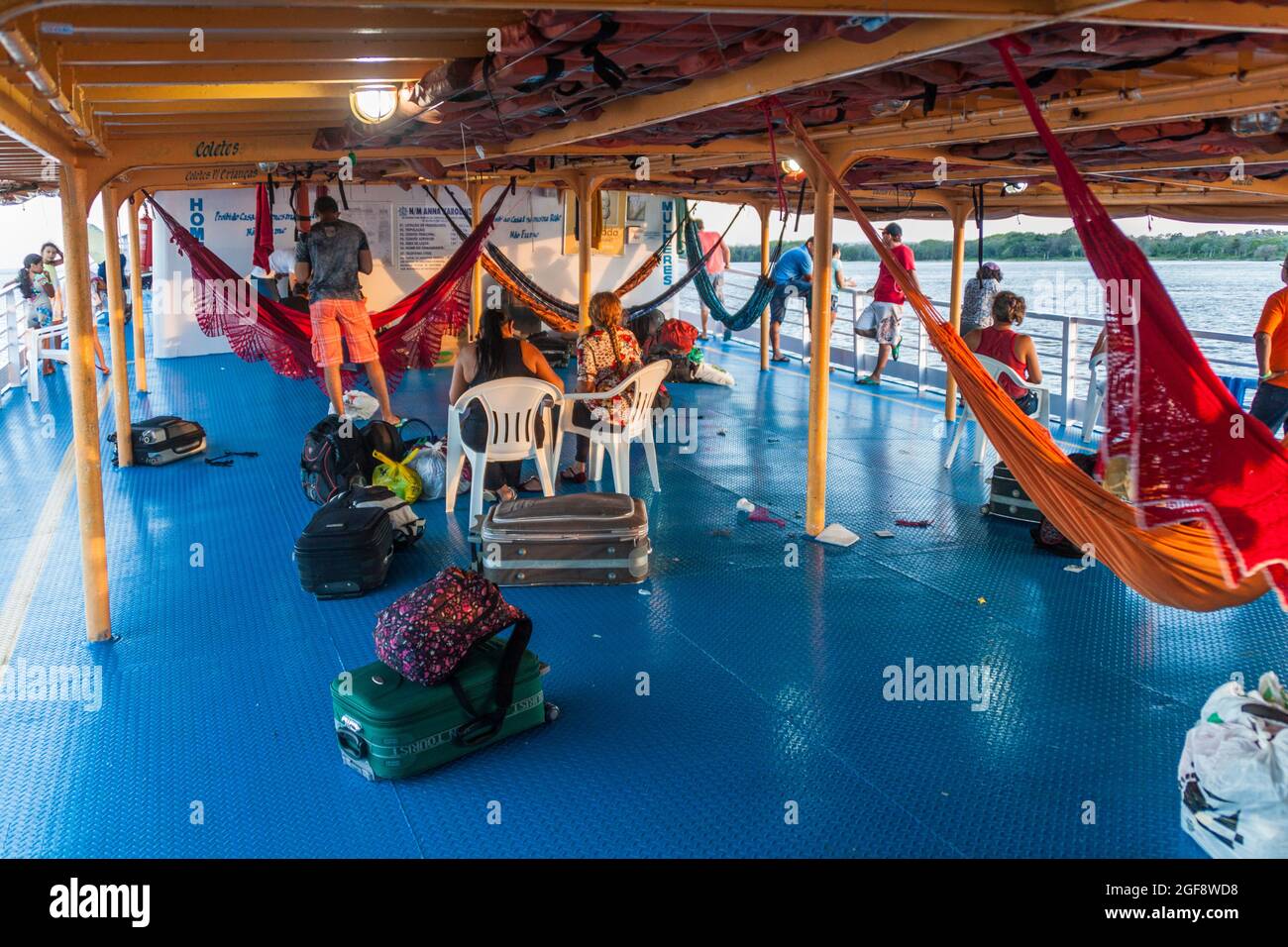 AMAZON, BRAZIL - JUNE 28, 2015: Pople are leaving the hammock deck at the boat Anna Karoline II which plies river Amazon between Santarem and Manaus, Stock Photo