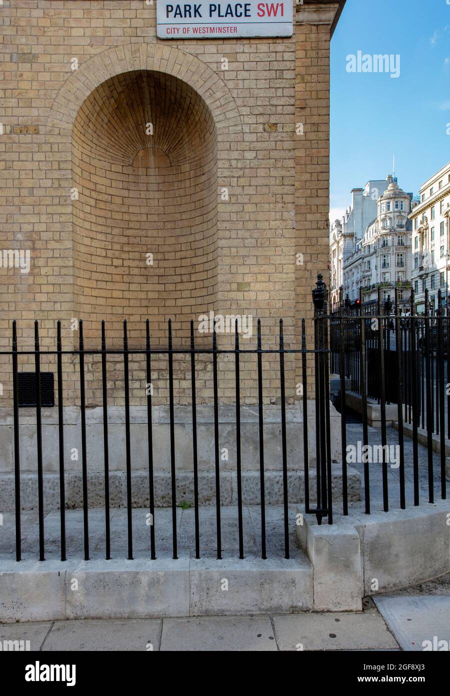 Street sign for Park Place, a cul-de-sac off St James's St, London; on a brick wall behind a set of iron railings Stock Photo