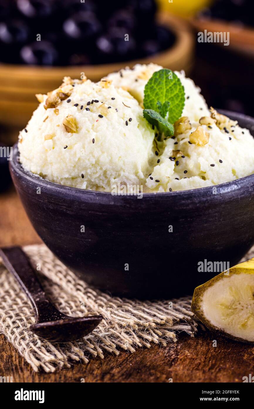 banana vegan ice cream without milk in handmade clay bowl, healthy food