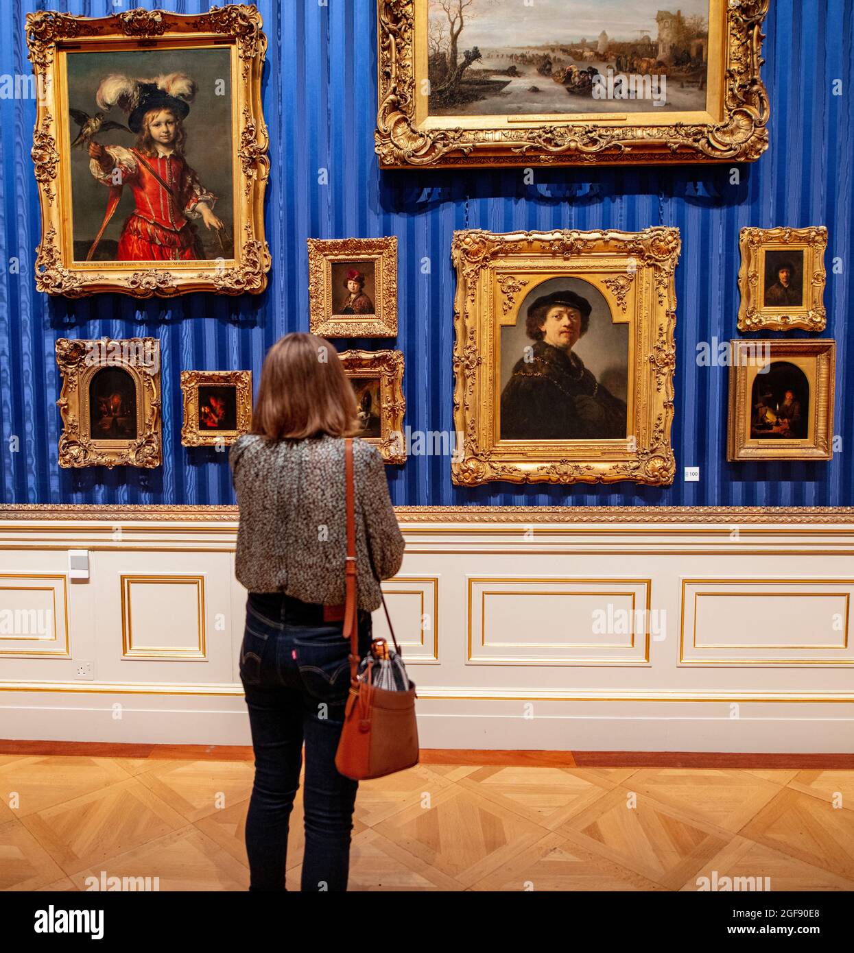 Woman looking at Rembrandt self-portrait in The Wallace Collection, Hertford House, Manchester Square, London Stock Photo