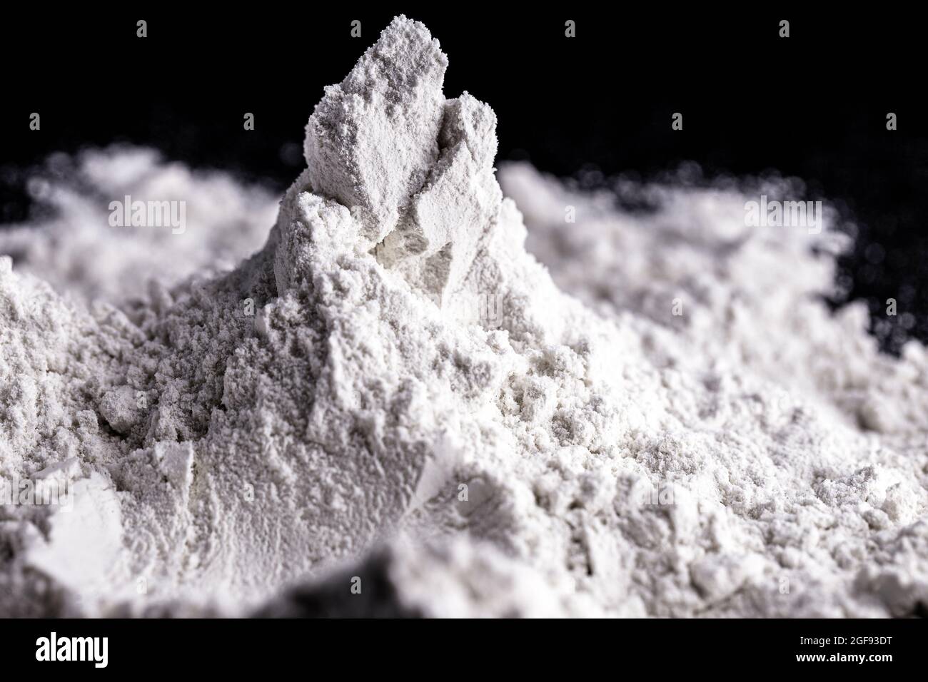 Kaolin on isolated black background, is an inorganic mineral Stock Photo