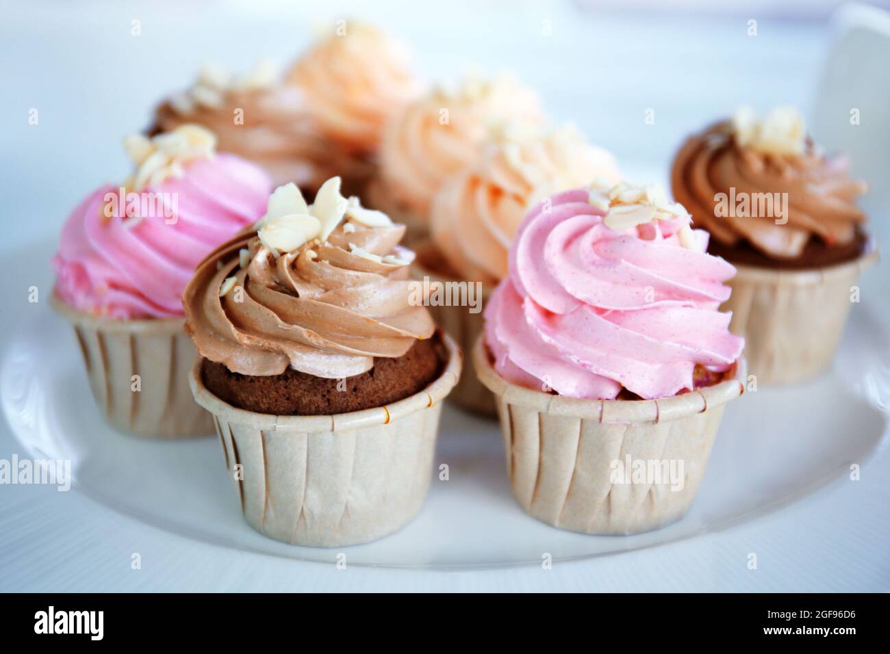 Creamy cupcakes on table closeup Stock Photo - Alamy