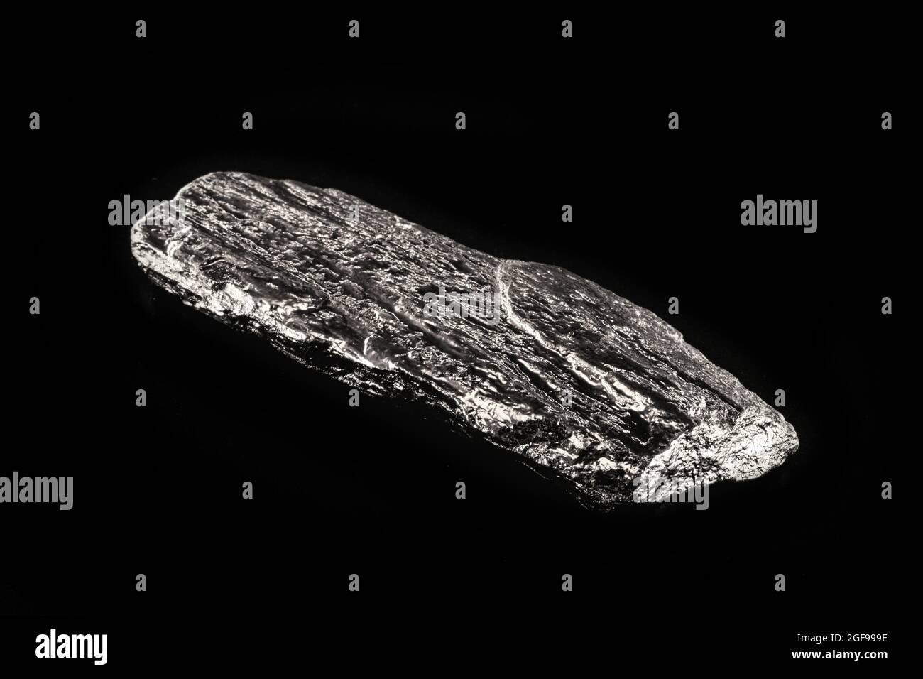 Tin is a chemical element with the symbol Sn, a pure tin nugget, used to produce various metal