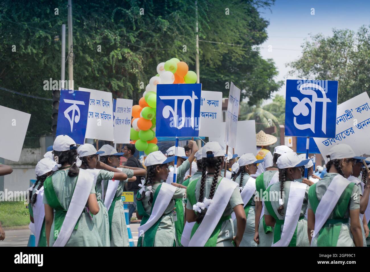 KOLKATA, WEST BENGAL / INDIA - AUGUST 15TH, 2016 : Young girls carrying placards about 'Kanyashree' scheme of West Bengal Government which empowers gi Stock Photo