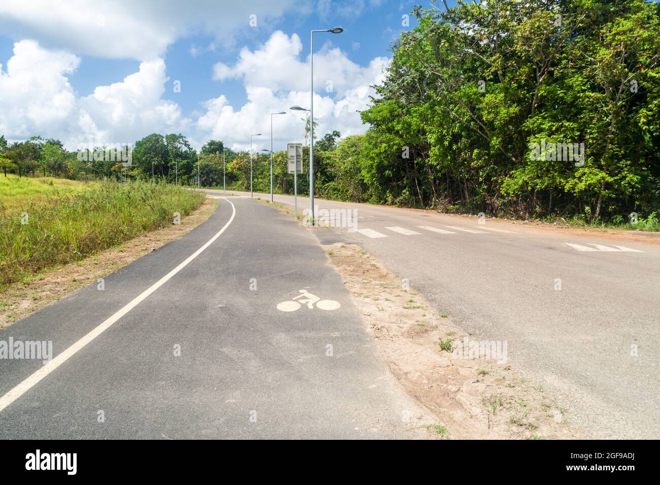 Road with bicycle lane in Saint-Georges town, French Guiana Stock Photo
