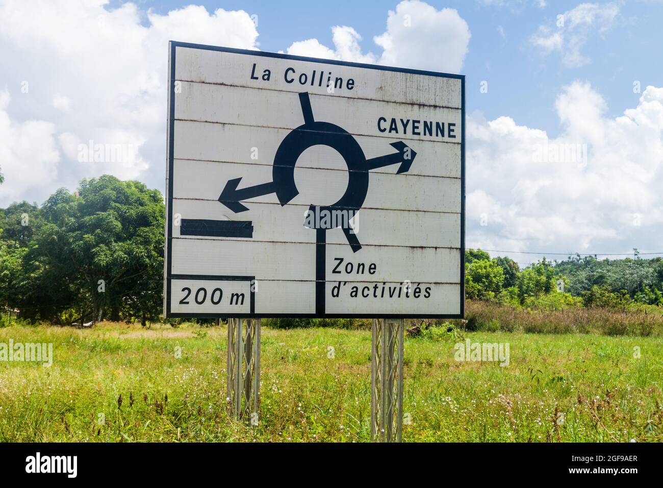 Roadsign at a roundabout (located in Saint-Georges) pointing to Cayenne, French Guiana Stock Photo