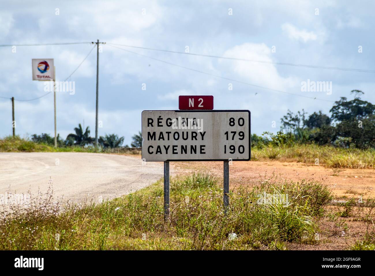 Roadsign (located in Saint-Georges) pointing to Cayenne and other cities in French Guiana Stock Photo