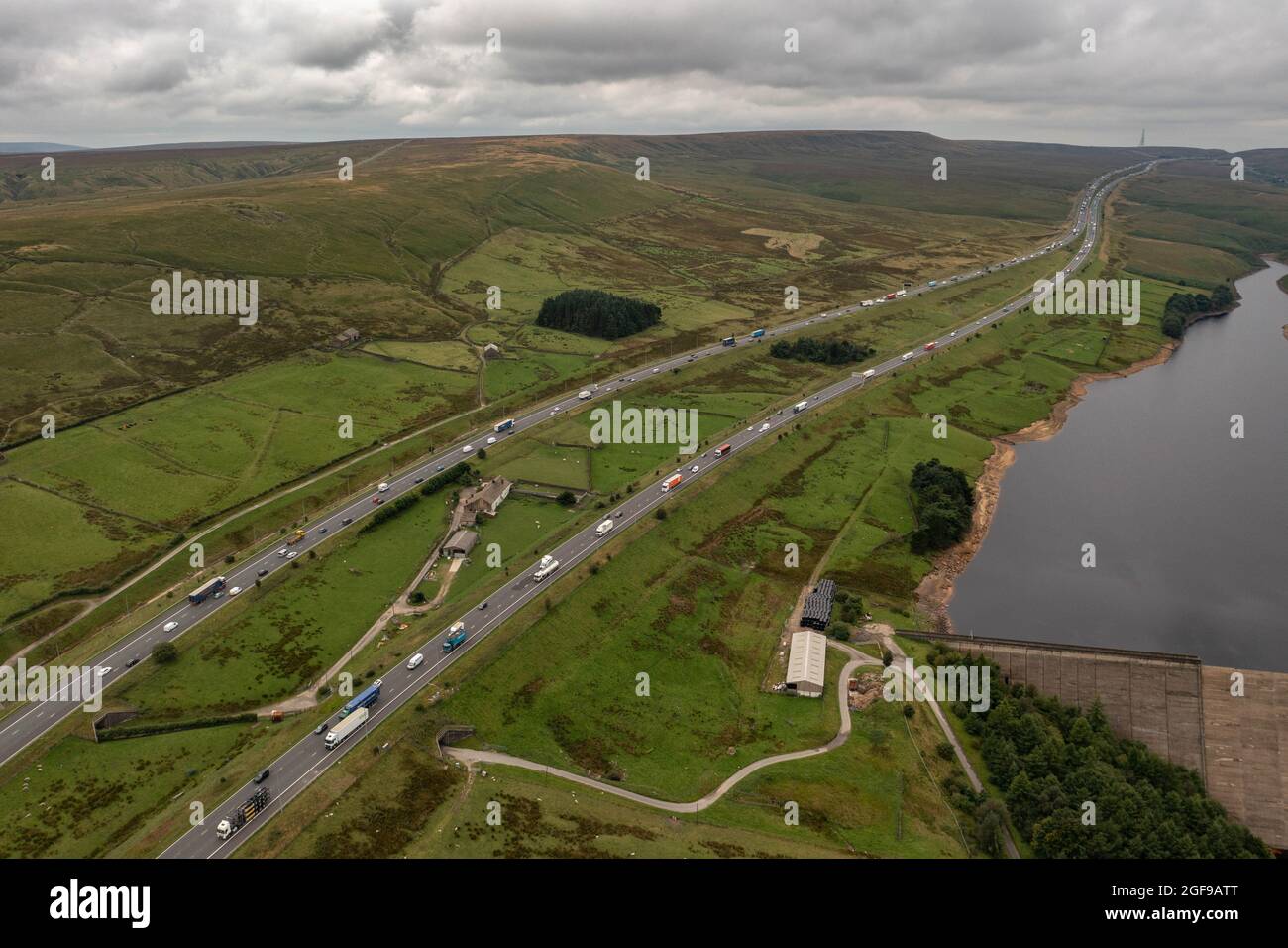 Rishworth Moor Motorway Ainley Top M62 Stott Hall Farm Aerial Birds Eye View The House in the Middle of the road  the M62 motorway was built around Stock Photo