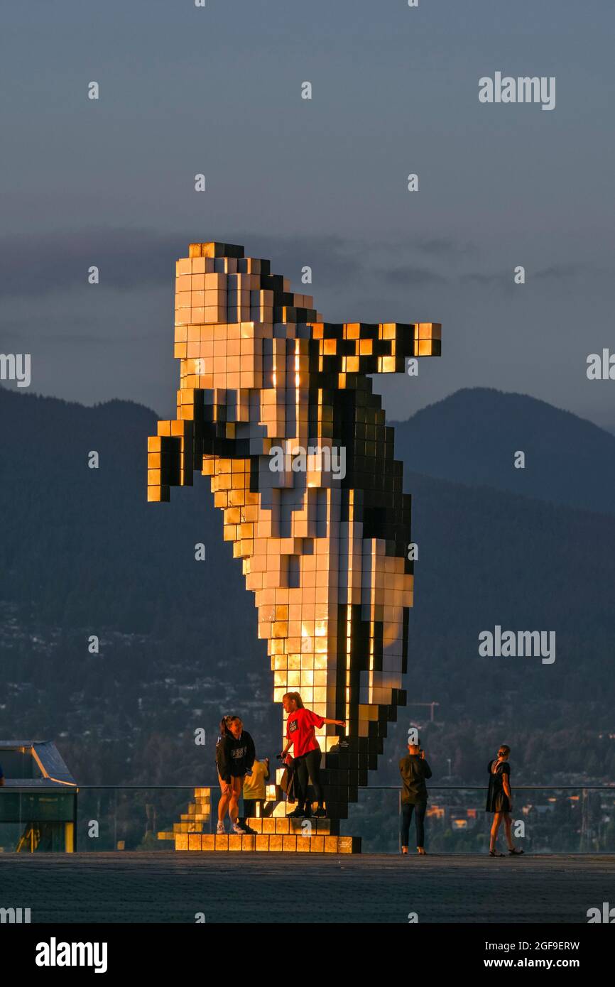 Tourists near Digital Orca sculpture by Douglas Coupland, Jack Poole Plaza, Vancouver, British Columbia, Canada Stock Photo