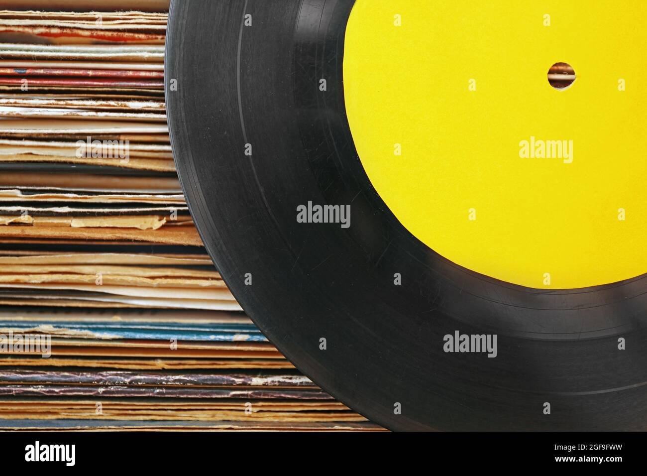 Old vinyl records with yellow label on paper background Stock Photo Alamy