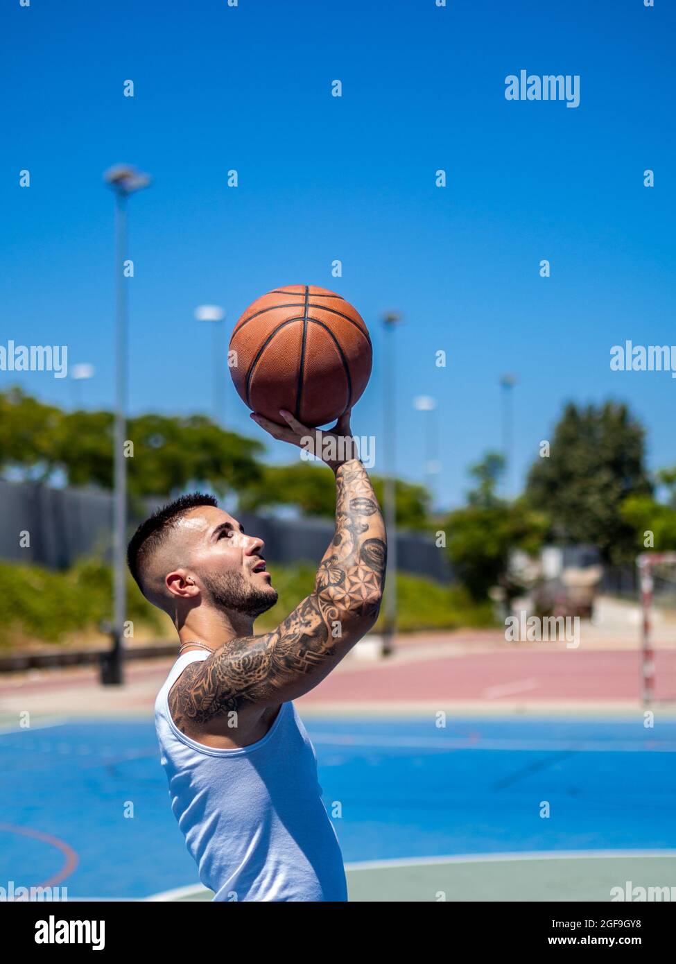 Athletic handsome Spanish basketball player training on court Stock Photo -  Alamy