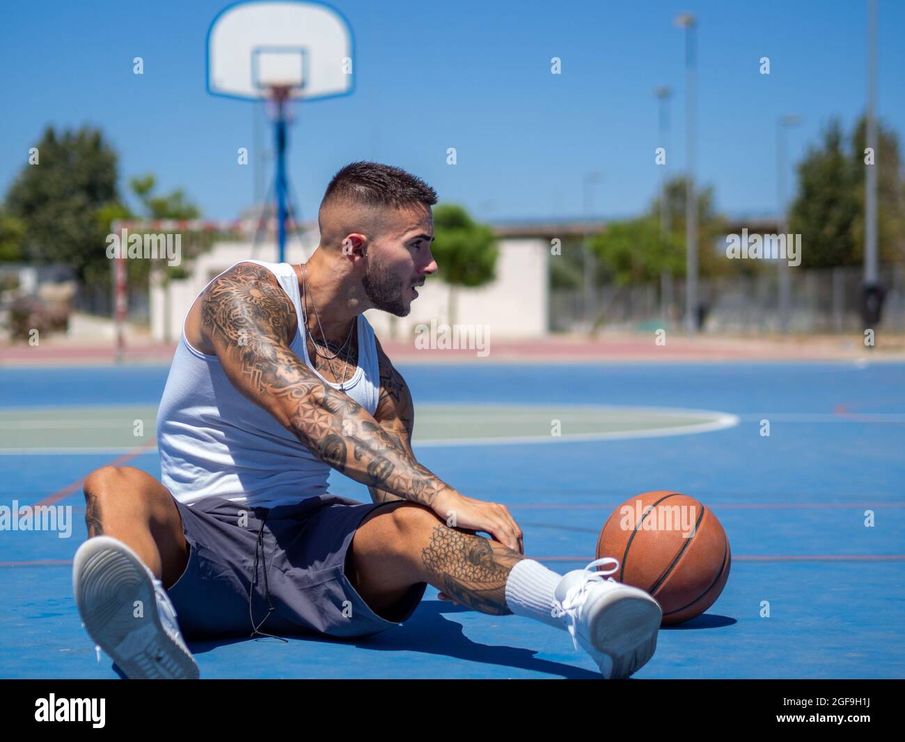Athletic handsome Spanish basketball player training on court Stock Photo -  Alamy