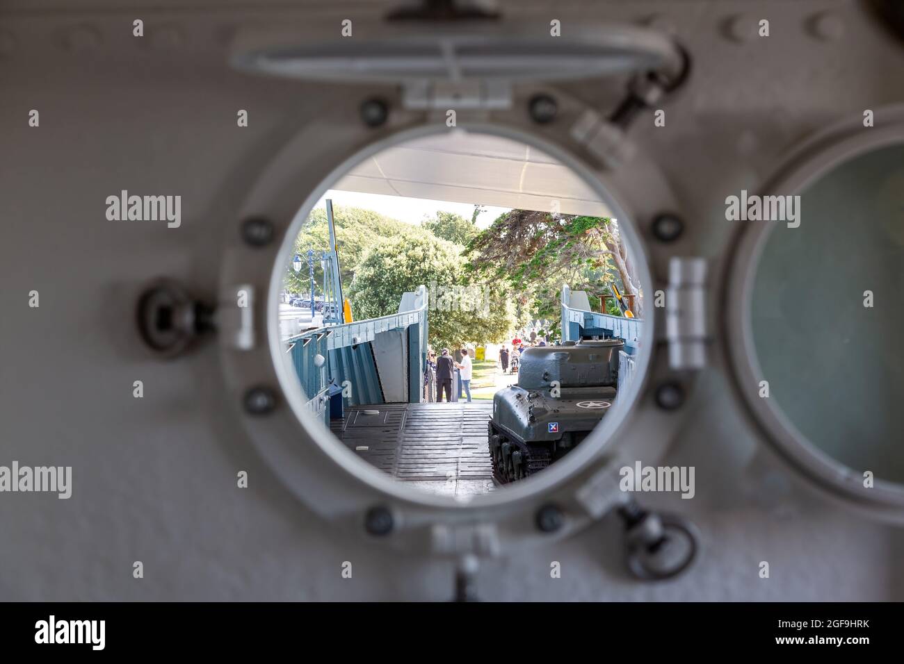 08-24-2021 Portsmouth, Hampshire, UK, Looking through a Port Hole on a ship or Landing craft on LCT 7074 landing craft at the D-Day story Museum Stock Photo