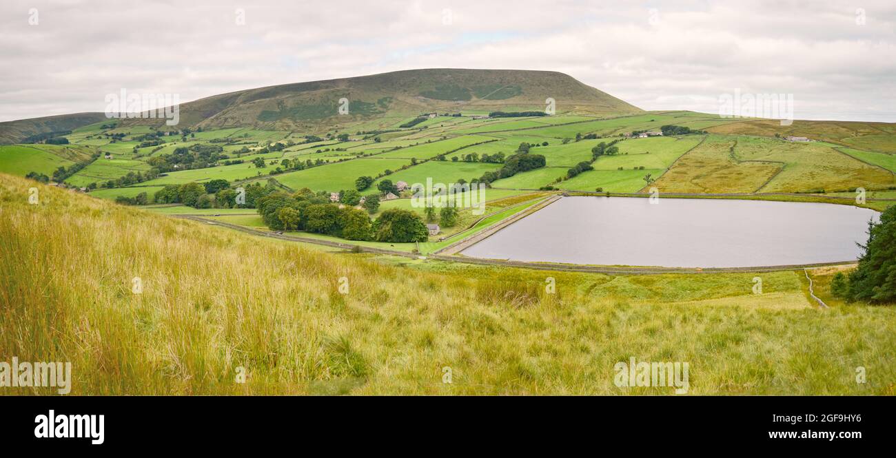 Black Moss reservoir lies in the shadow of Pendle Hill, a local landmark, and is near the village of Barley in Lancashire. Stock Photo