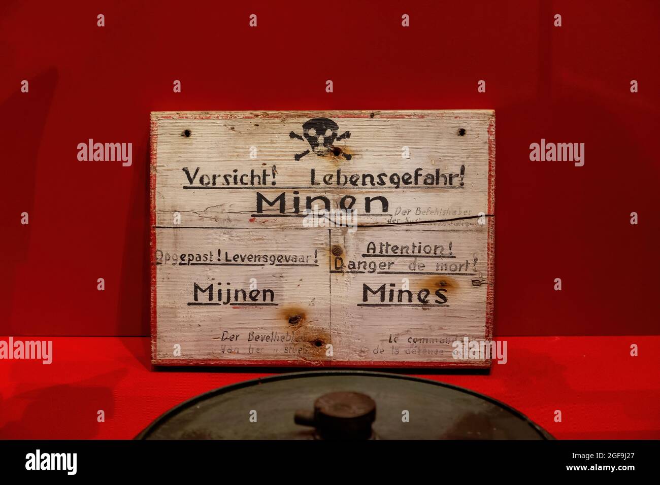 08-24-2021 Portsmouth, Hampshire, UK, A German world war two mine field warning sign with a mine in front shown at the D-Day story museum Southsea Stock Photo