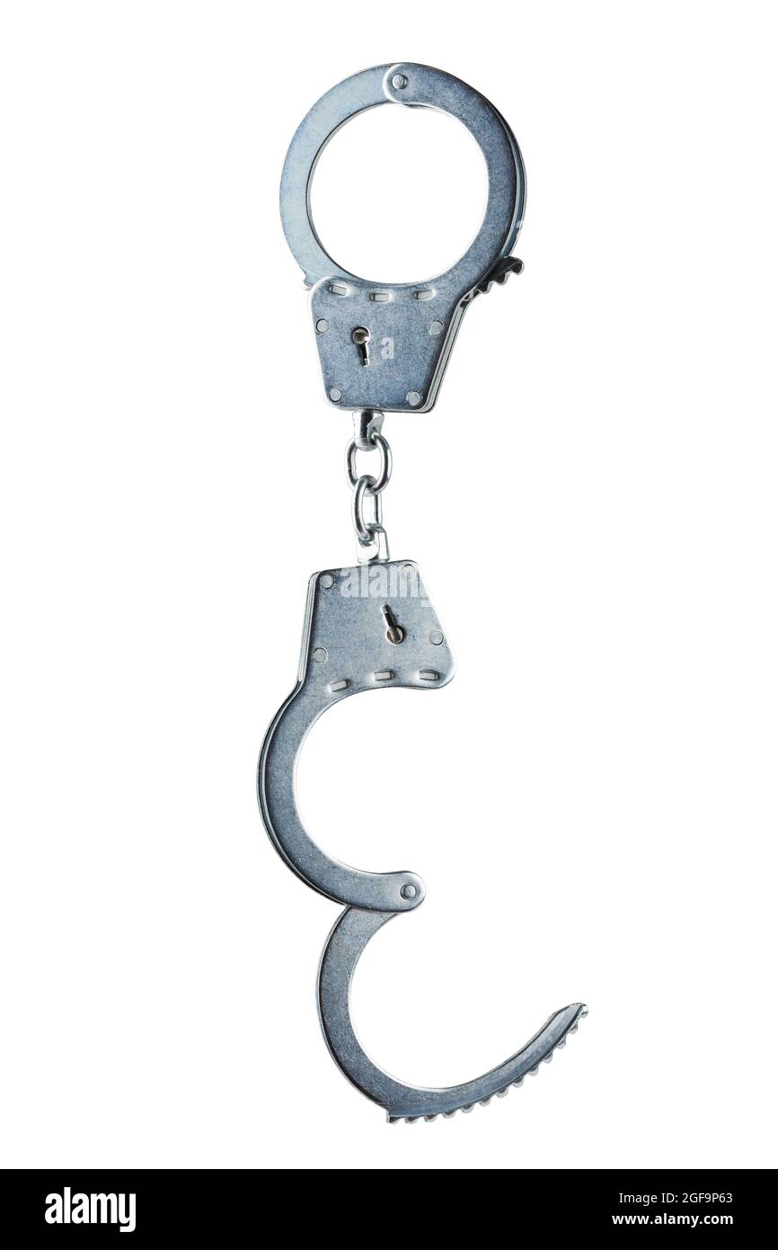 real zinc plated steel police handcuffs half-opened hanging vertically, isolated on white background Stock Photo