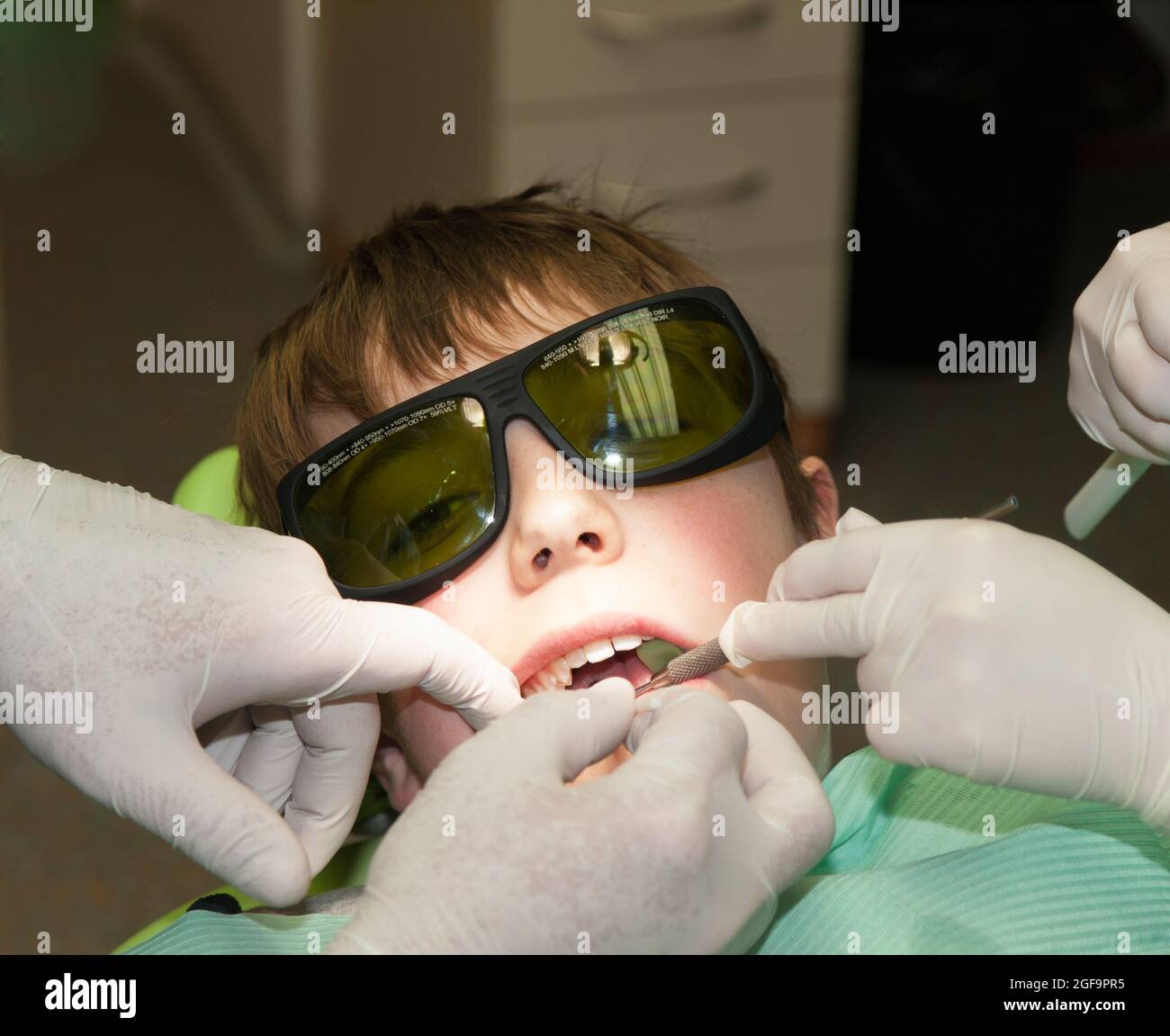 Boy with glasses in dental office Stock Photo