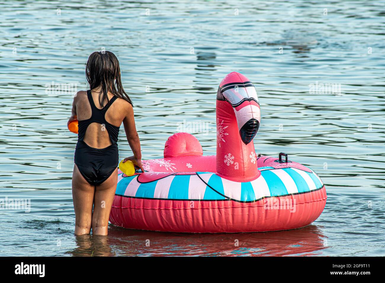 Little girl having fun on a summer day Stock Photo
