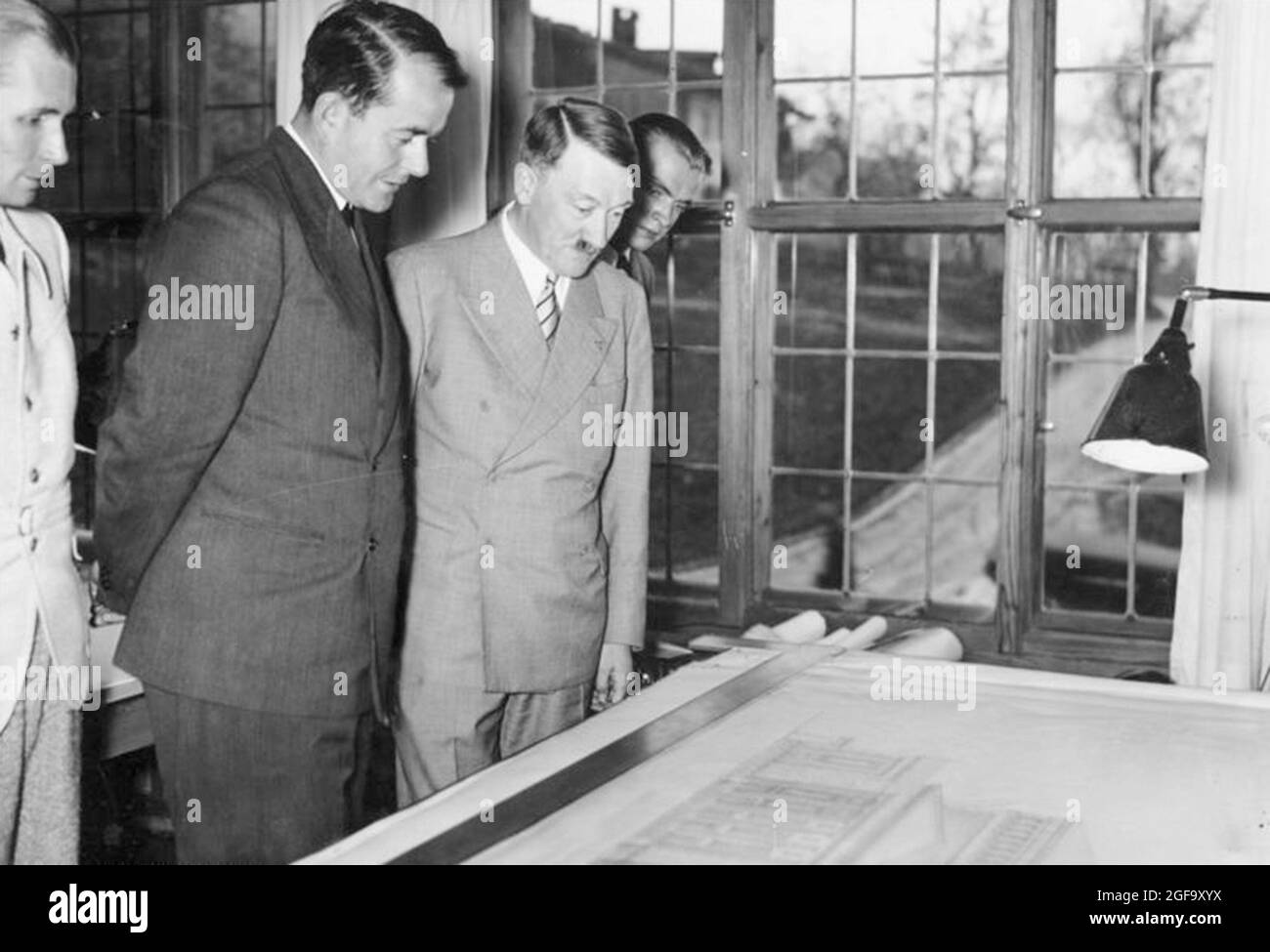 Hitler and Albert Speer together in the Obersalzburg looking at plans for a new opera house in Linz, Austria. Credit: German Bundesarchiv Stock Photo