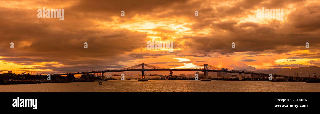 Sunset on the Mactan Channel in Cebu with the Marcelo B. Fernan Bridge, Philippines. Five photos were combined for this panorama image. Stock Photo
