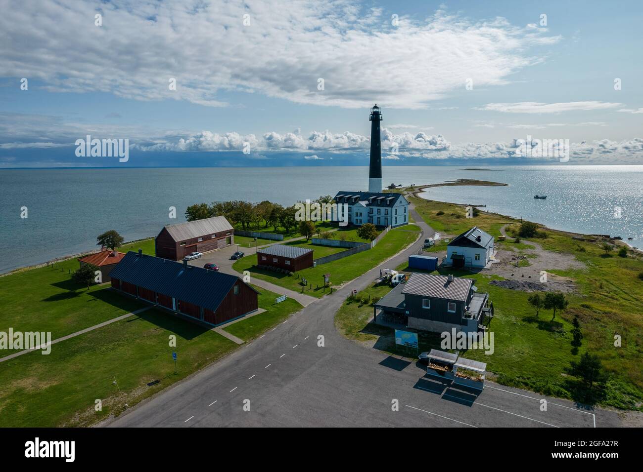 Sõrve Säär, Saaremaa, Estonia - August 23, 2021: Tip of Sõrve cape with Sõrve lighthouse and magical cloudy sky. Aerial drone photo in Saaremaa Sõrve Stock Photo