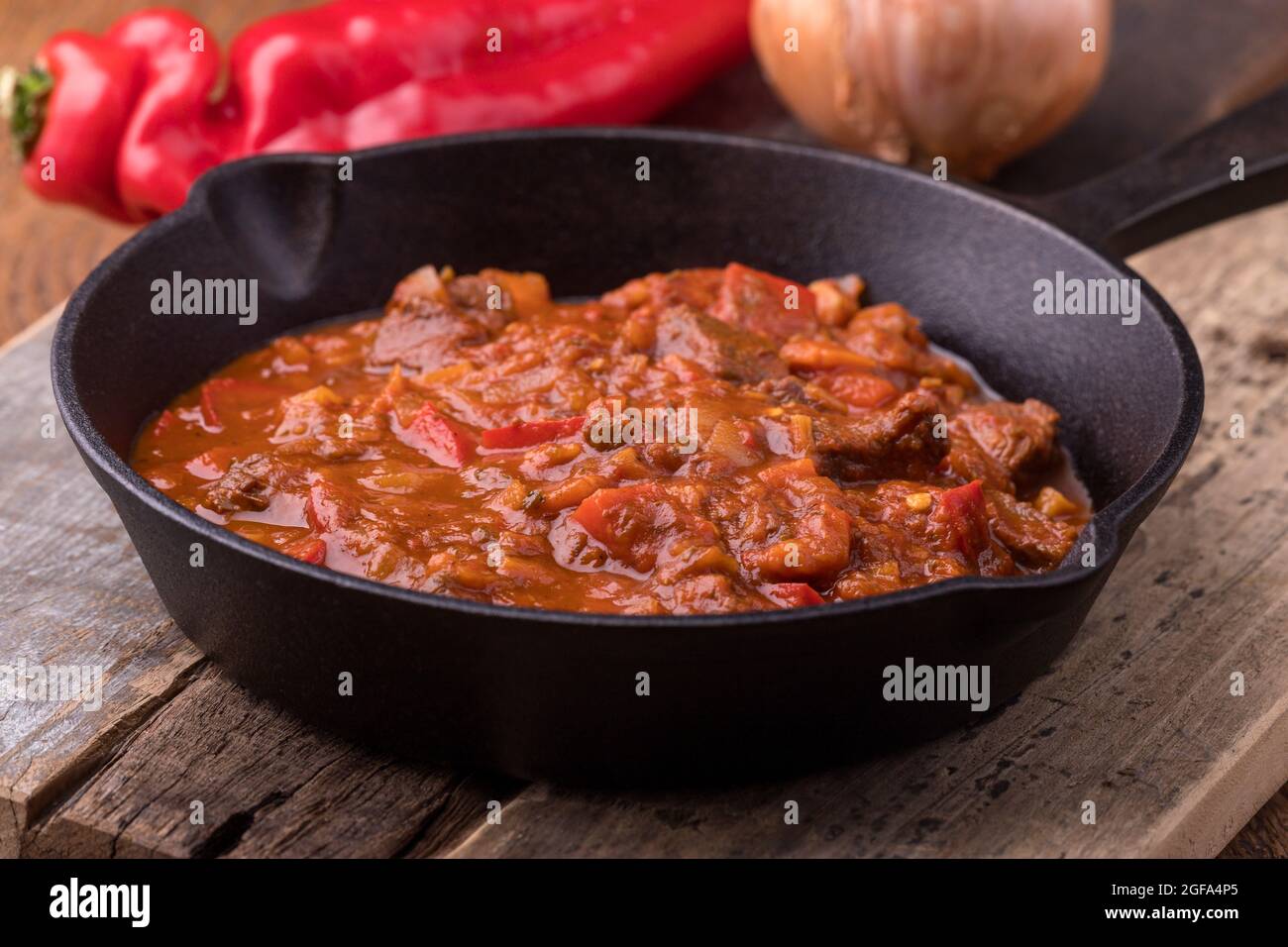 hungarian goulash in an iron pan Stock Photo - Alamy